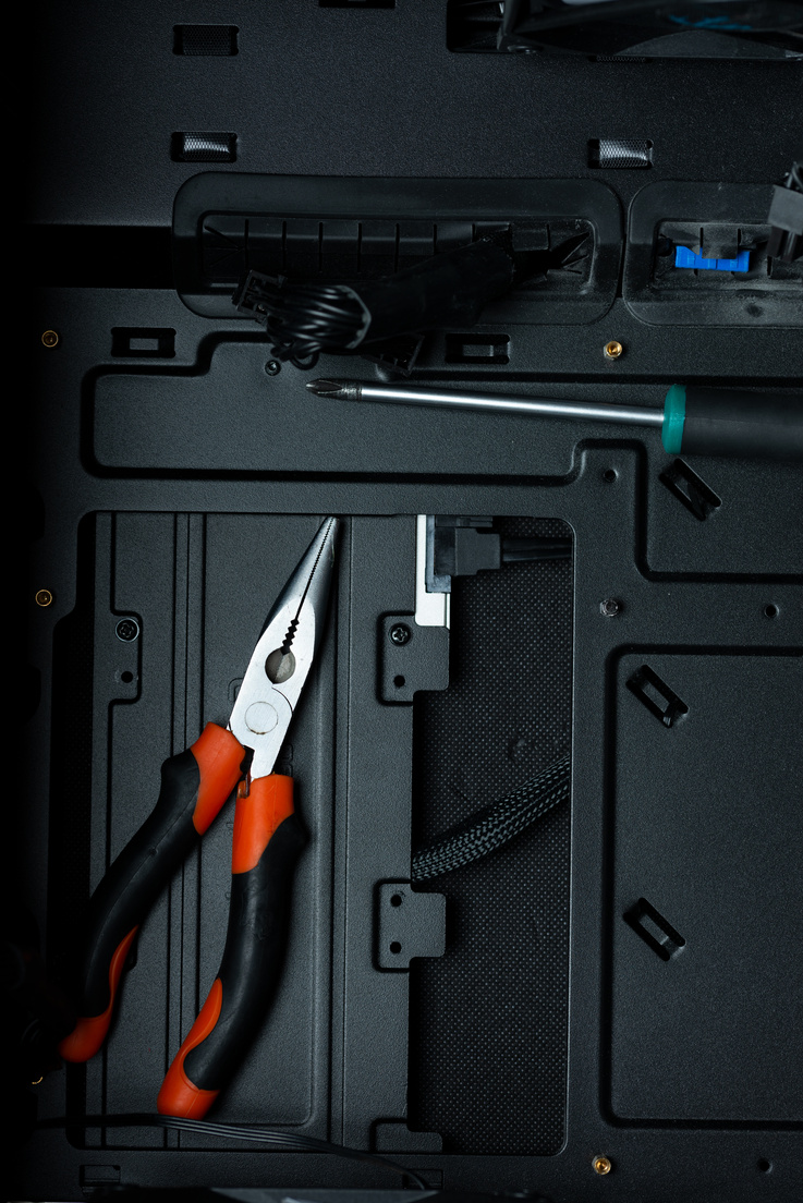 Tools inside Pc case, representing pc building and service.